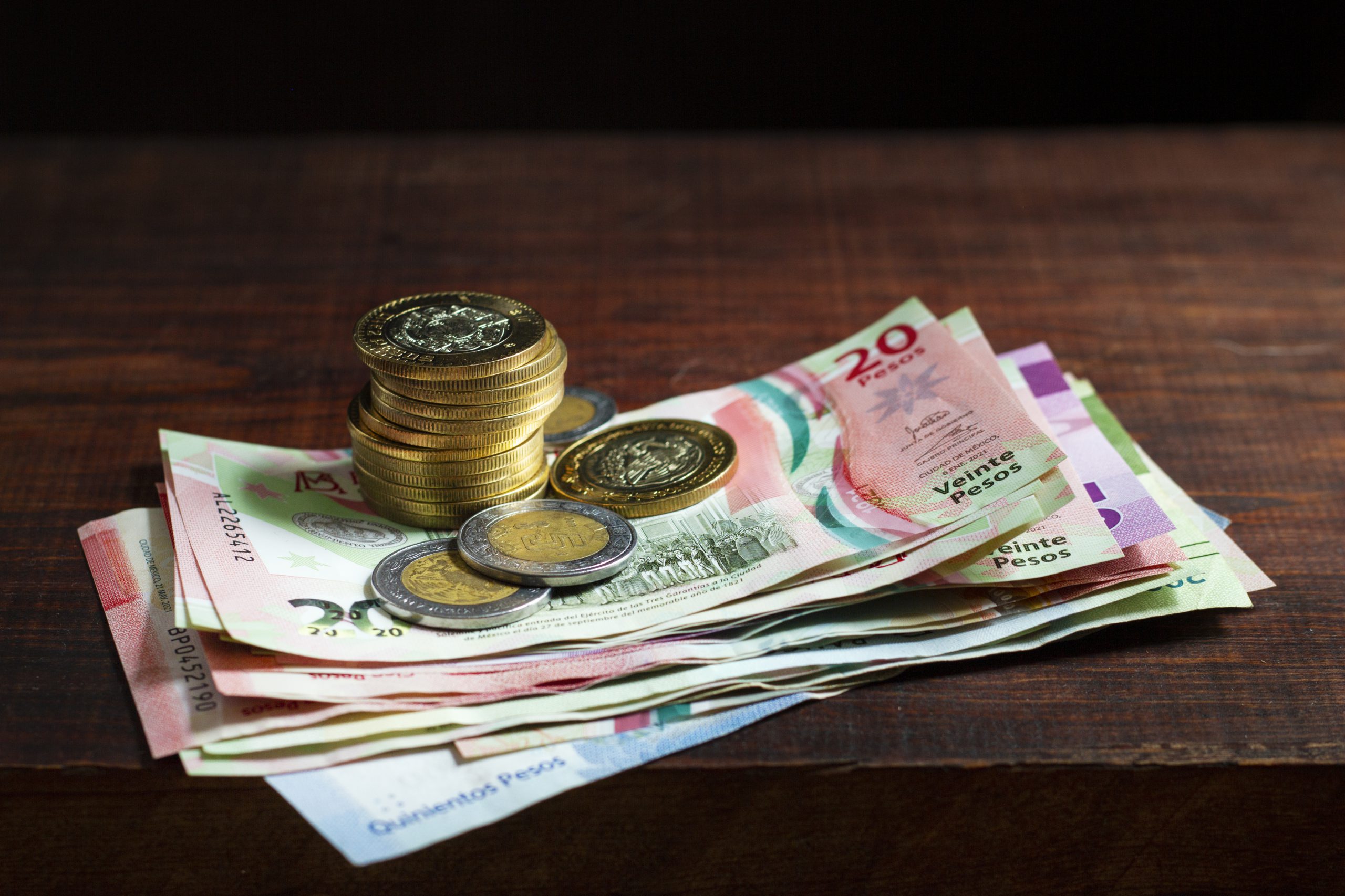 high-angle-banknotes-coins-arrangement